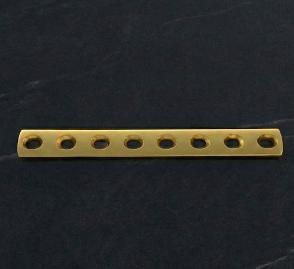 Snow-capped mountains at sunrise reflected in a lake